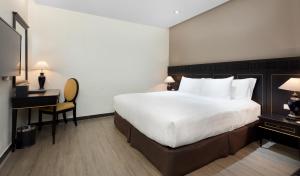 Postel nebo postele na pokoji v ubytování Hotel Sapa Square Affiliated by Melia