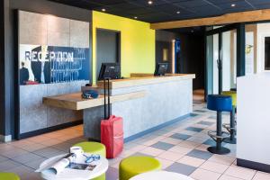 The lobby or reception area at Ibis Budget Orly Chevilly Tram 7