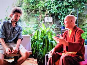 two men sitting next to each other in a garden at Zen Harmony House Sydney in Sydney +12 photos