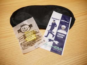 a black hat with a ticket and a bag of cigarettes at First Cabin Kansai Airport in Izumi-Sano +13 photos