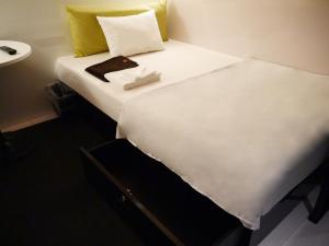 Säng eller sängar i ett rum på First Cabin Kansai Airport