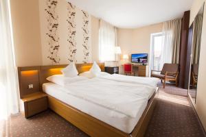 Ένα ή περισσότερα κρεβάτια σε δωμάτιο στο Hotel Marienlinde