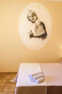 Postel nebo postele na pokoji v ubytování Olimpo B&B + 37 fotografií