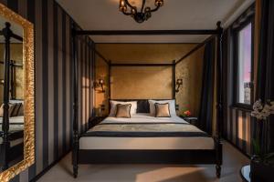 a bedroom with a large bed and a large window at Carnival Palace - Venice Collection in Venice