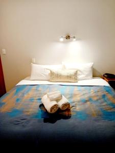 Postel nebo postele na pokoji v ubytování Academy Lodge Motel