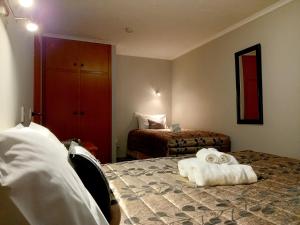 Postel nebo postele na pokoji v ubytování Academy Lodge Motel