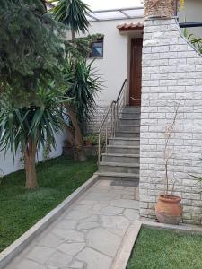 A garden outside Fyllou Apartment Asprovalta