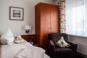 Postel nebo postele na pokoji v ubytování Garni Hotel & Appartements Nordstrand