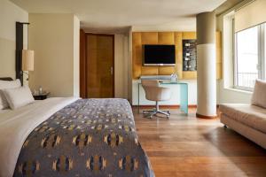 Un pat sau paturi într-o cameră la DO&CO Hotel Vienna
