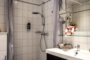 Koupelna v ubytování Garni Hotel & Appartements Nordstrand + 37 fotografií