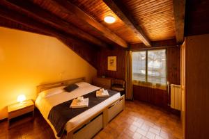 Postel nebo postele na pokoji v ubytování Hotel Valle Pesio Ristorante