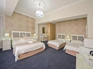 Postel nebo postele na pokoji v ubytování The Russel Hotel