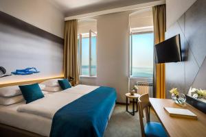 Postel nebo postele na pokoji v ubytování Hotel Istra - Liburnia