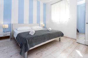 Кровать или кровати в номере Apartments Magdales