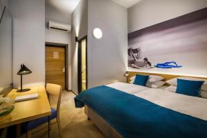 Postel nebo postele na pokoji v ubytování Hotel Istra - Liburnia
