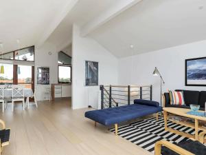 a living room with a bed and a dining room at 6 person holiday home in Bogense in Bogense