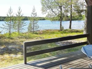 a porch with a view of a lake at 5 person holiday home in L GDE in Himmersundet