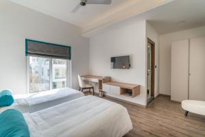 Postel nebo postele na pokoji v ubytování SKYLA Studios & Suites - Jubilee Hills