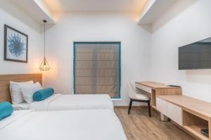 Postel nebo postele na pokoji v ubytování SKYLA Studios & Suites - Jubilee Hills