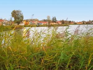 een waterlichaam met wat gras en huizen bij 12 person holiday home in Otterndorf in Otterndorf