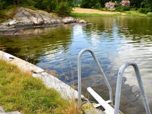 a body of water with two metal objects in the water at 4 person holiday home in LYSEKIL in Brastad