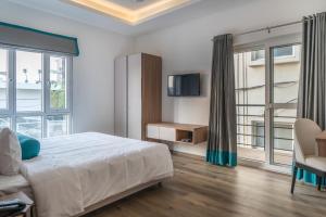 Postel nebo postele na pokoji v ubytování SKYLA Studios & Suites - Jubilee Hills