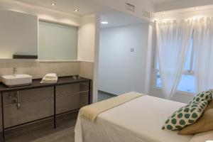 Postel nebo postele na pokoji v ubytování Apartamentos Constitución by Renthas