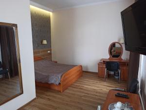 Postel nebo postele na pokoji v ubytování Central Hotel