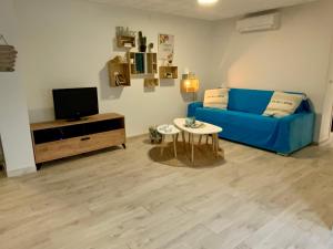 TV a/nebo společenská místnost v ubytování Magnifique appartement en front de mer, Caneylles