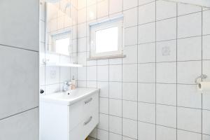 Koupelna v ubytování Apartments Diora