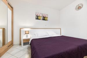Postel nebo postele na pokoji v ubytování Apartments Diora