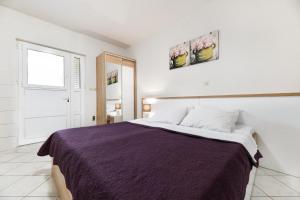 Postel nebo postele na pokoji v ubytování Apartments Diora
