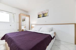 Postel nebo postele na pokoji v ubytování Apartments Diora
