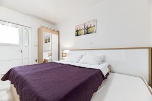 Postel nebo postele na pokoji v ubytování Apartments Diora