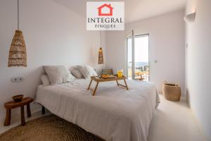 A bed or beds in a room at Palamós Moonlight Apartment