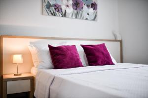 Postel nebo postele na pokoji v ubytování Apartments Diora