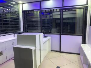 a large room with white counters and large windows at Hotel JK Lions - Koradi Road Nagpur in Nagpur