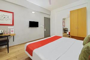 Ένα ή περισσότερα κρεβάτια σε δωμάτιο στο Kanak Beacon Hotel - Ashram Road Ahmedabad