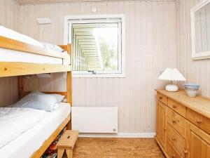 Postel nebo postele na pokoji v ubytování 6 person holiday home in Pandrup-By Traum