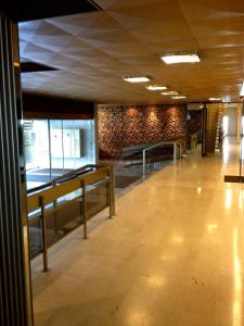 an empty hallway with benches in a building at Residence Luxurious Genève in Geneva