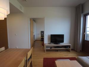 TV a/nebo společenská místnost v ubytování Holiday Home Nordic chalet 9304 by Interhome