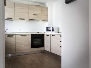 A kitchen or kitchenette at Apartment Casa Rasat-1 by Interhome
