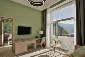 TV a/nebo společenská místnost v ubytování Garden Resort