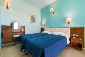 Voodi või voodid majutusasutuse Poseidon Suites by CorfuEscapes toas