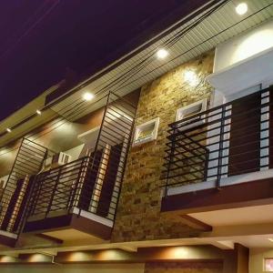 a building with balconies on the side of it at Livewire Planet Suites in General Santos