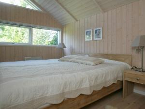 a bedroom with a large bed and a window at Luxury Retreat in Marielyst - By Traum Ferienwohnungen in Marielyst