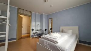 Postel nebo postele na pokoji v ubytování Hotel Cranach-Herberge City Centre