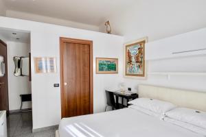 מיטה או מיטות בחדר ב-Aiello Suites Milan