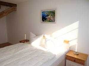 Postel nebo postele na pokoji v ubytování Speicher Residenz Barth E2 App10