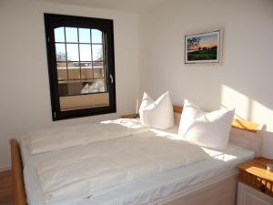 Postel nebo postele na pokoji v ubytování Speicher Residenz Barth E2 App10